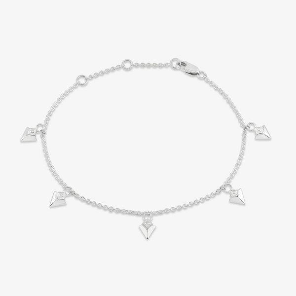 Silver bracelet with arrow spike charms on white background