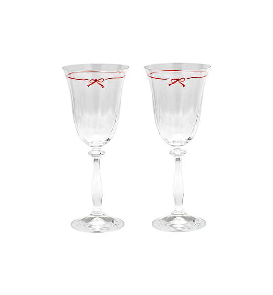 Wine glasses with illustrated bows around the rim on white background
