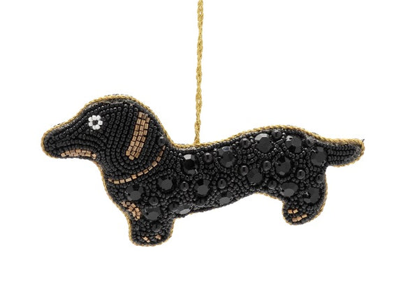 Decorative beaded  black sausage dog ornament with bead details on a white background