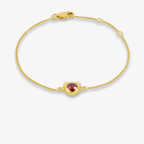 Gold Love Heart garnet bracelet on a white background