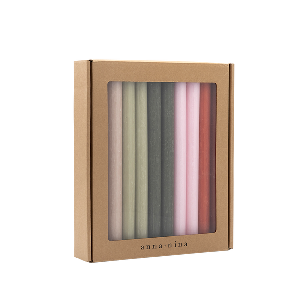 Box of pastel coloured candles with  on a white background