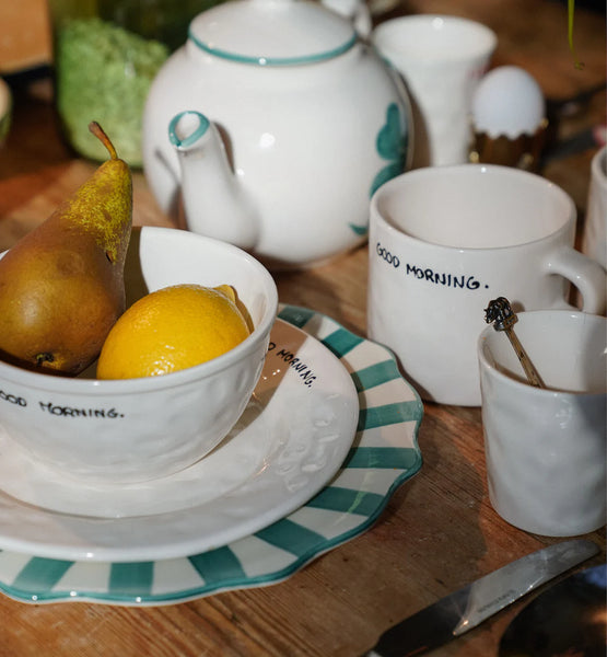 Table with anna + nina crockery on it