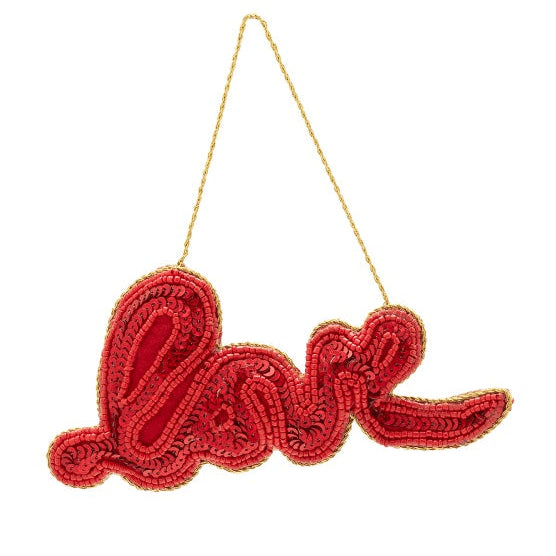 Red 'love'  beaded ornament with gold thread on a white background