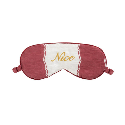 Sleep mask with 'Nice' text on a white background