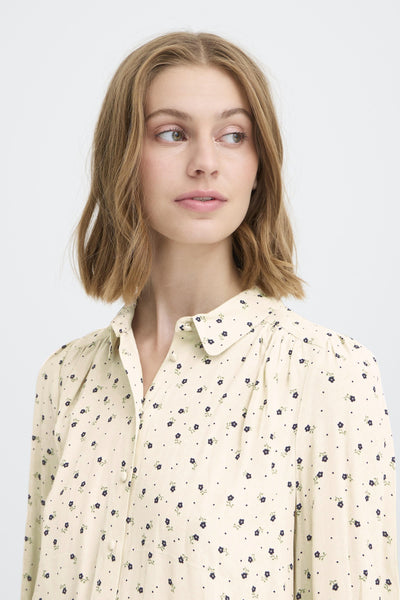 Cream pan collared shirt with floral details by Atelier Reve