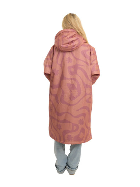 Person wearing a long pink camo changing robe showing the back of the coat on a white background.  