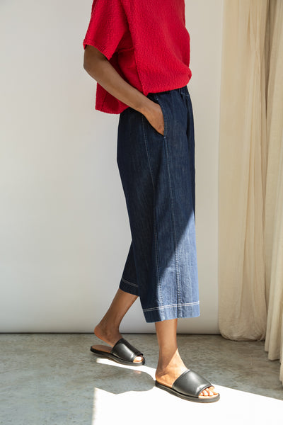 Nicole-Leigh, a classic dark denim blue wide-leg culotte style trouser from Beaumont Organic
