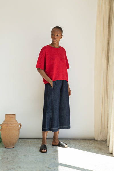Nicole-Leigh, a classic dark denim blue wide-leg culotte style trouser from Beaumont Organic