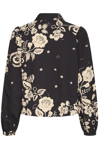 Black shirt with beige flower design showing from the back