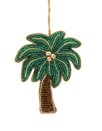 Decorative hand beaded palm tree ornament with beads on a white background