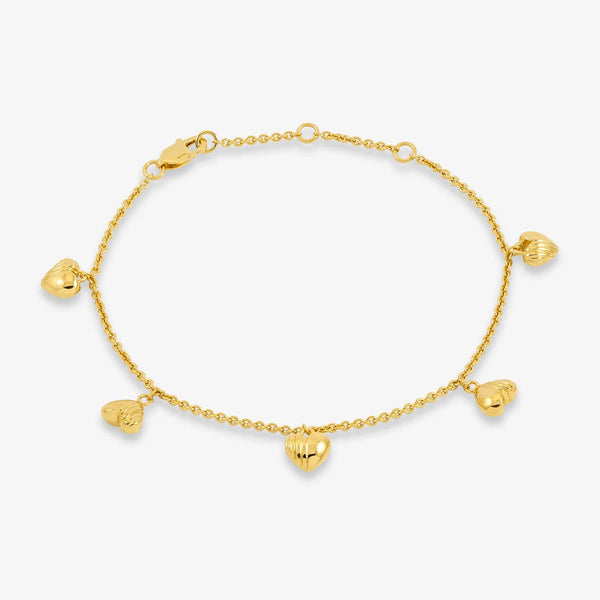 Gold bracelet with heart charms on white background