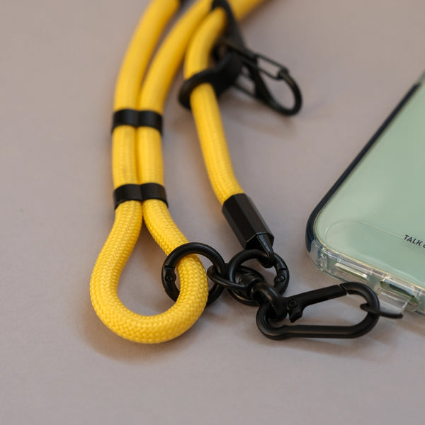 Adjustable yellow phone lanyard strap designed for comfortable crossbody wear and convenient smartphone access.