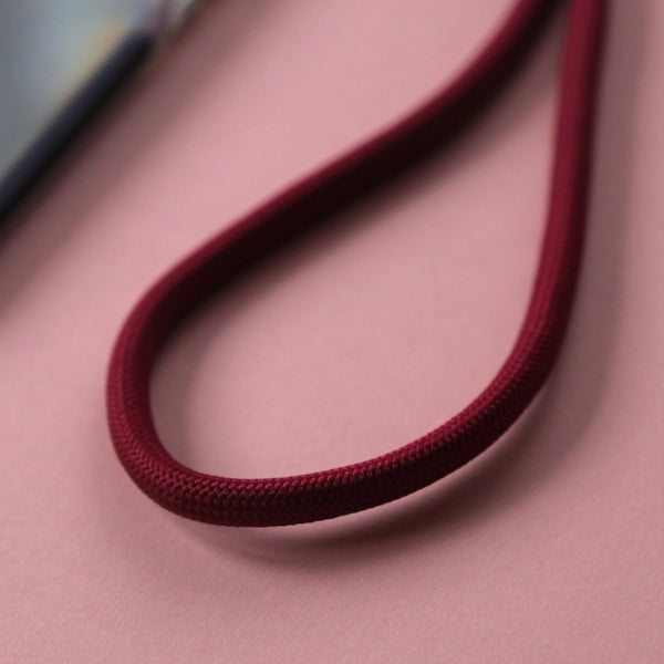 Burgundy crossbody phone strap keeping your smartphone secure and accessible while shopping, travelling, or commuting.