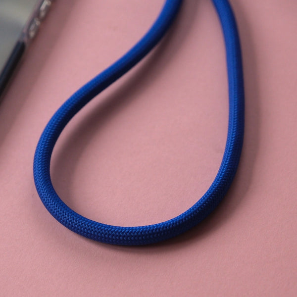 Electric blue adjustable phone lanyard with crossbody design for convenient hands-free everyday use.