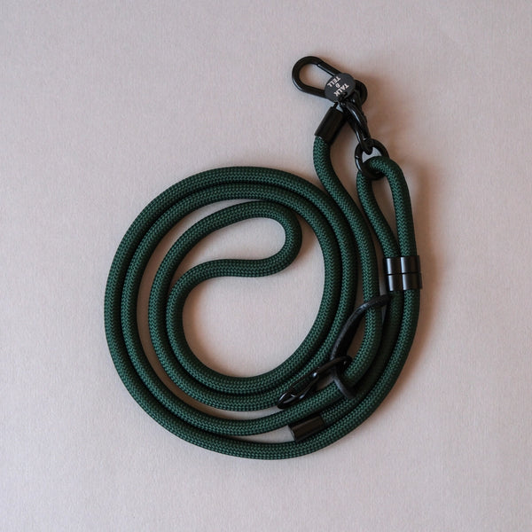 Forest green crossbody rope phone strap keeping your smartphone secure and accessible while travelling, shopping, or commuting.