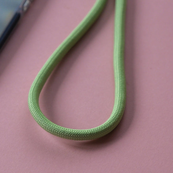 Light green adjustable rope phone lanyard with crossbody design for convenient hands-free everyday use.