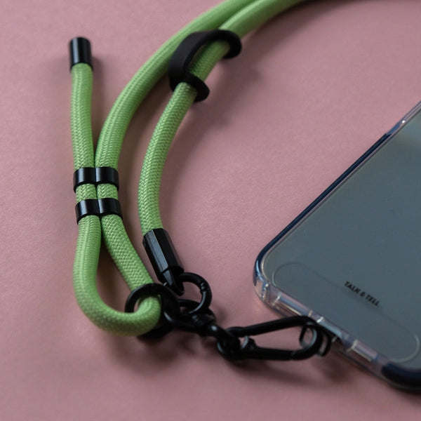 Light green crossbody rope phone strap keeping your smartphone secure and accessible while travelling, shopping, or commuting.