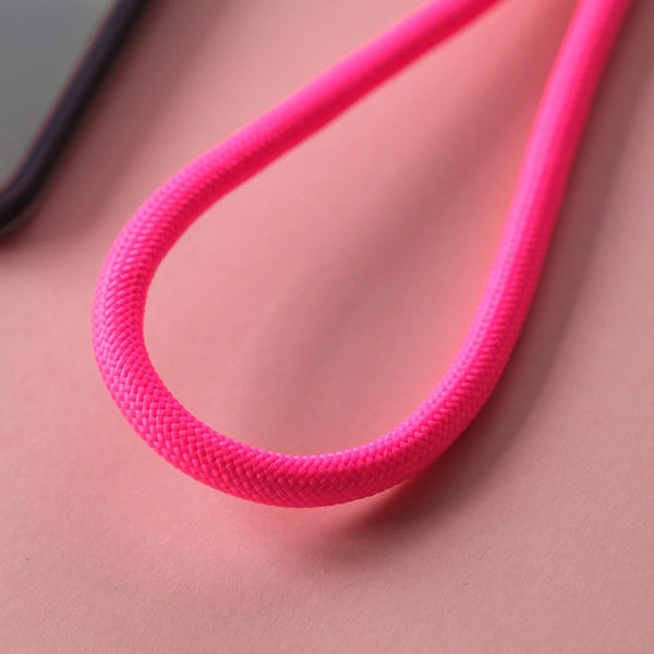 Pink crossbody phone strap keeping your smartphone secure and accessible while travelling, shopping, or commuting.