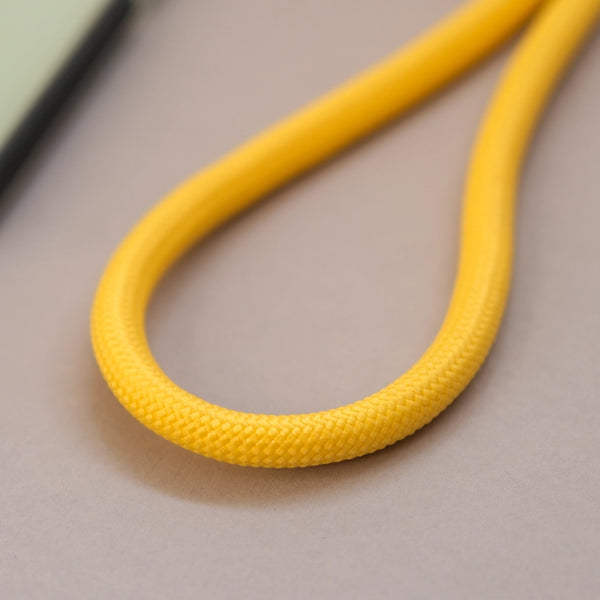 Yellow adjustable phone lanyard with crossbody design for convenient hands-free everyday use.